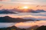 The sun ascends over the mountains, casting a warm glow through the drifting clouds